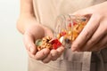 Young woman holding glass jar with different dried fruits and nuts Royalty Free Stock Photo