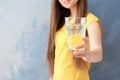 Young woman holding glass of lemon water Royalty Free Stock Photo