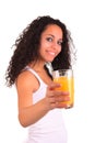 Young woman holding glass of orange juice isolated over white ba Royalty Free Stock Photo