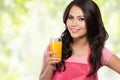 Young woman holding glass of orange juice Royalty Free Stock Photo