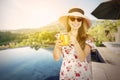 Young woman holding a glass of orange juice Royalty Free Stock Photo