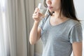 Young woman holding glass of water. Diet girl drinking water after wake up. Healthy lifestyle concept. Closeup, copy space Royalty Free Stock Photo