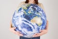 Young woman holding globe Royalty Free Stock Photo