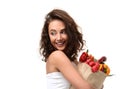 Young woman holding grocery paper shopping bag full of fresh vegetables. Diet healthy eating concept Royalty Free Stock Photo