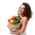 Young woman holding grocery paper shopping bag full of fresh vegetables. Diet healthy eating concept Royalty Free Stock Photo