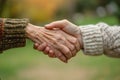 Young woman holding the hand of a senior. Taking care of the elderly concept. Generative AI Royalty Free Stock Photo