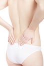 Young woman holding hands for back pain, backache Royalty Free Stock Photo