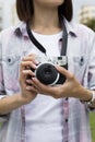 Young woman holding in hands old vintage camera Royalty Free Stock Photo