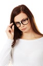 Young woman holding her glasses Royalty Free Stock Photo