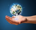 Woman holding a glowing earth globe Royalty Free Stock Photo