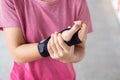 Young woman holding her wrist pain because using computer long time. De Quervain`s tenosynovitis, Intersection Symptom, Carpal Royalty Free Stock Photo