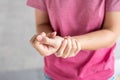 Young woman holding her wrist pain because using computer long time. De Quervain`s tenosynovitis, Intersection Symptom, Carpal Royalty Free Stock Photo