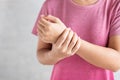 Young woman holding her wrist pain because using computer long time. De Quervain`s tenosynovitis, Intersection Symptom, Carpal Royalty Free Stock Photo