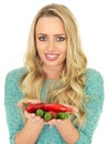 Young Woman Holding Hot Spicy Red and Green Chillies Royalty Free Stock Photo