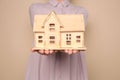 Young woman holding house model Royalty Free Stock Photo