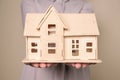 Young woman holding house model Royalty Free Stock Photo