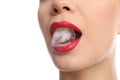 Young woman holding ice cube in mouth on white background Royalty Free Stock Photo