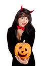 Young Woman Holding Jack o'Lantern in Costume of Black Devil on