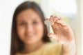 Young woman holding key of her new house, closeup Royalty Free Stock Photo