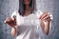 Young woman holding a key and a house Royalty Free Stock Photo