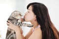 Young woman holding and kissing her lovely cat Royalty Free Stock Photo