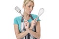 Young Woman Holding a Kitchen Slice and Whisk Royalty Free Stock Photo