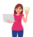 Young woman holding laptop computer and showing cash, money, currency notes. Trendy girl using digital device. Female character.