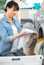 young woman holding laundry basket full clothes Royalty Free Stock Photo