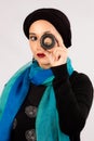 Young Woman holding a lens in hijab and colorful scarf Royalty Free Stock Photo