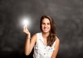 Young woman holding a lightbulb Royalty Free Stock Photo