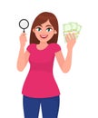 Young woman holding magnifying glass. Girl showing cash, money, currency notes in hand. Female character design illustration. Royalty Free Stock Photo