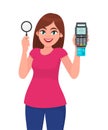 Young woman holding magnifying glass. Girl showing credit, debit, ATM card payment machine POS terminal. Female character design Royalty Free Stock Photo