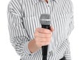 Young woman holding microphone on white background Royalty Free Stock Photo