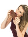 Young Woman Holding a Milk Chocolate Bar Royalty Free Stock Photo