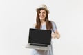 Young woman holding modern laptop pc computer with blank black empty screen to copy space isolated on white background Royalty Free Stock Photo