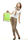 Young woman holding multicolored paper bags