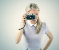 Young woman holding old film camera Royalty Free Stock Photo