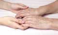 A young woman holding an older womans hands Royalty Free Stock Photo