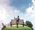 Young woman holding open book on wooden Royalty Free Stock Photo