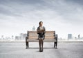 Young woman holding open book on wooden Royalty Free Stock Photo