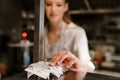 Young woman holding order receipts while working in restaurant kitchen Royalty Free Stock Photo