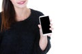 Young woman holding out a cellphone showing black empty blank screen in her hand Royalty Free Stock Photo