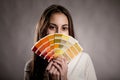 Young woman holding a pantone palette Royalty Free Stock Photo