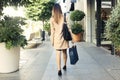 Young woman holding paper bag for the black friday at shopping mall Royalty Free Stock Photo