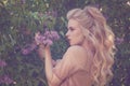 Young woman holding perfect spring flowers