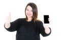 Young woman holding phone in her hand thumbs up Royalty Free Stock Photo