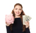 Young woman holding piggy bank and dollar banknotes on white background. Money savings concept Royalty Free Stock Photo