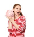 Young woman holding piggy bank on white background. Money savings concept Royalty Free Stock Photo