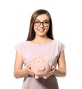 Young woman holding piggy bank on white background. Money savings concept Royalty Free Stock Photo