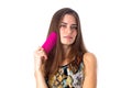 Young woman holding pink hair brush Royalty Free Stock Photo